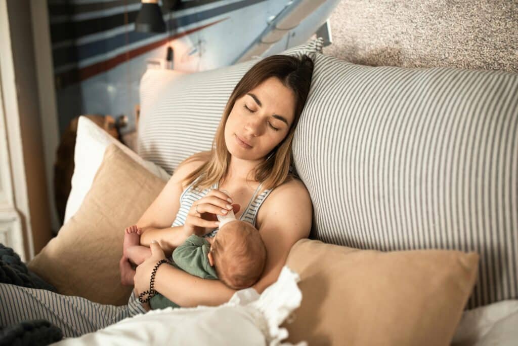 Peaceful moment of a mother and newborn baby relaxing at home. wake windows by age